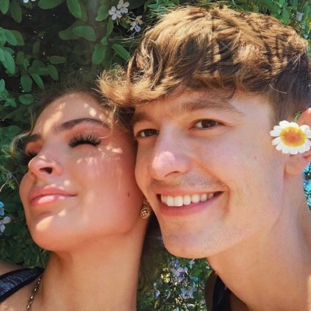 On the right side, FaZe with a flower on-ear upside, and on the left side, Carrington is giving a pose for a photo.